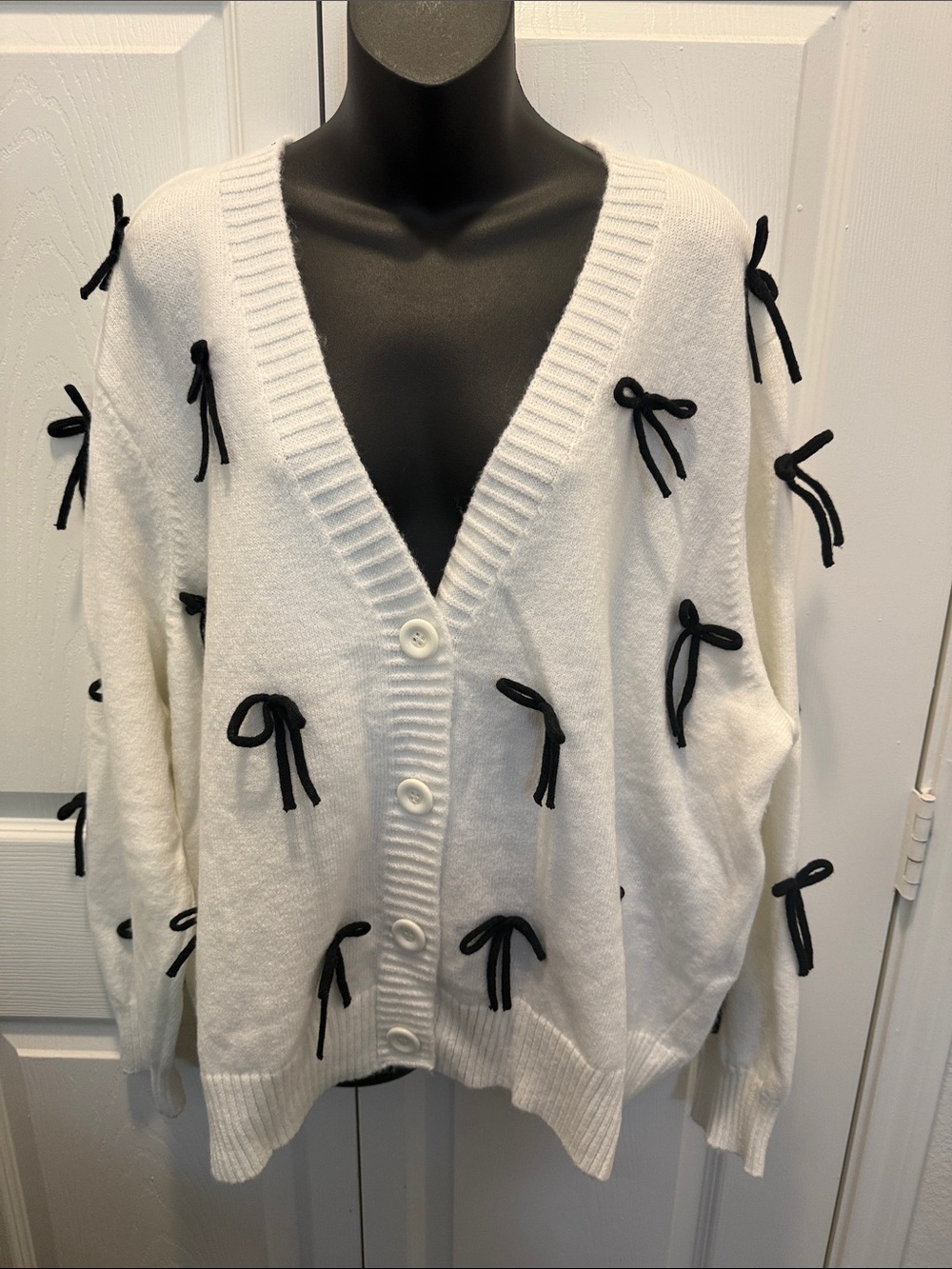 Cato White V-Neck Cardigan with Black Bow Details